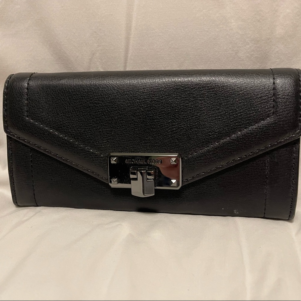 Black leather wallet with snap closure